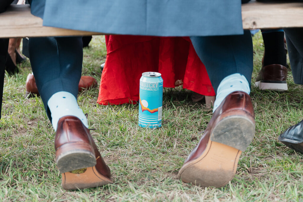 A guest's shoes and drink at a wedding in Big Sky, Montana